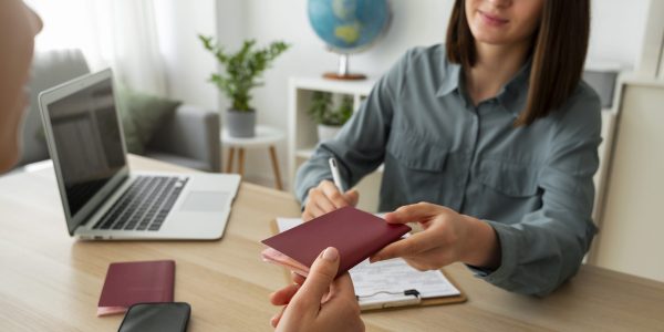 high-angle-woman-working-as-travel-agent